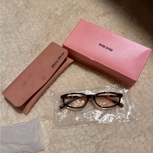 Miu Miu Tortoiseshell Glasses with Pink Accessories